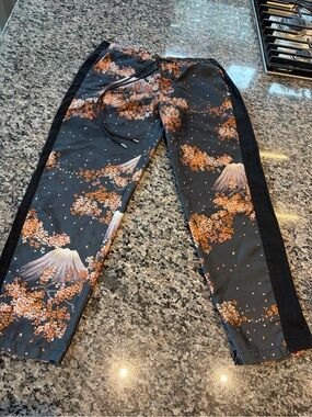 Women’s Black Floral Mountain Print Joggers with Orange Accents